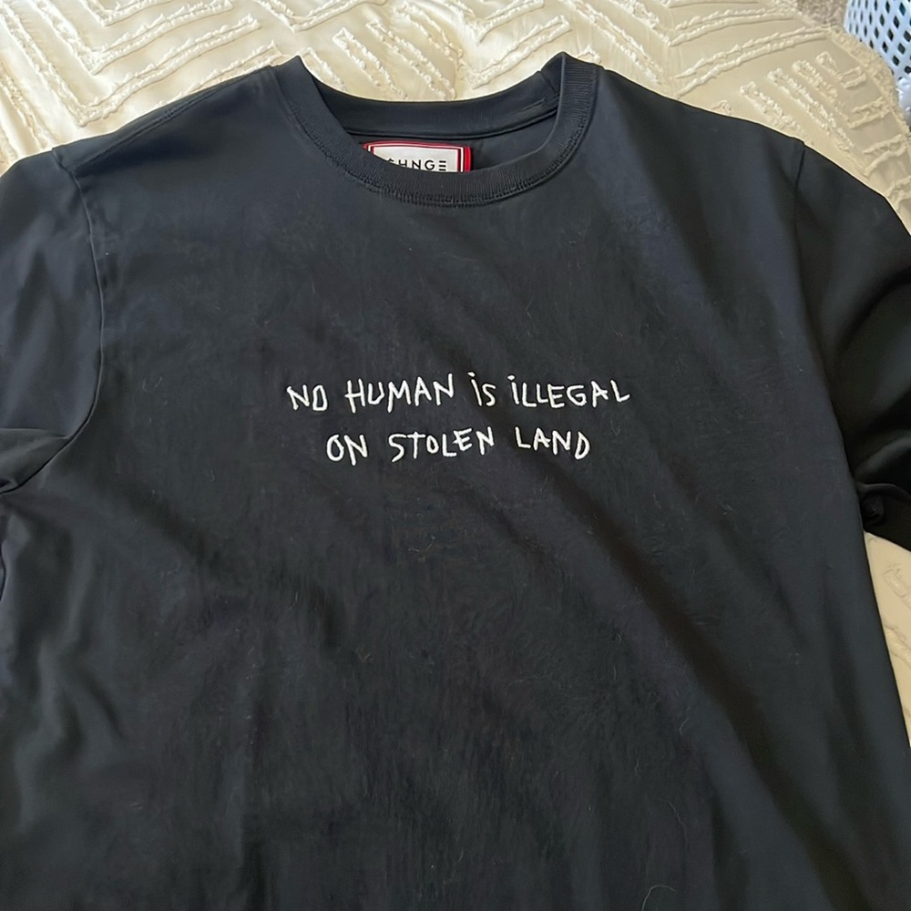 No Human is Illegal on stolen land black T-Shirt from Change